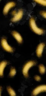 Abstract black and gold wallpaper with elegant, swirling patterns.