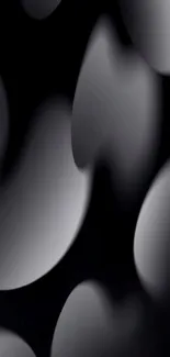 Elegant black wallpaper with abstract gradient shapes.