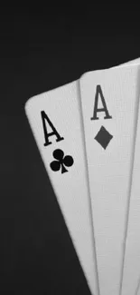 Monochrome wallpaper featuring four aces from a deck of cards.