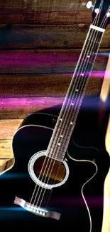 Elegant acoustic guitar with wooden background wallpaper.