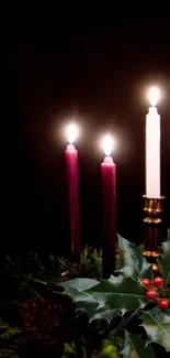 Mobile wallpaper with glowing Advent candles and holly decoration.