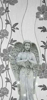 Elegant angel statue with floral pattern in gray tones wallpaper.