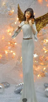 Elegant angel sculpture with golden wings and holiday lights.