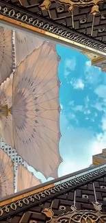Intricate architectural canopy against a blue sky.