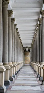 Elegant corridor with classic columns in a symmetrical arrangement.