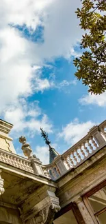 Elegant architectural building under a vibrant blue sky with tree leaves.