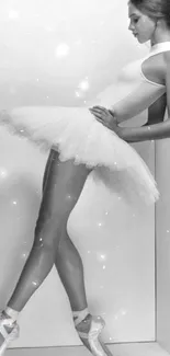 Monochrome image of a ballerina in elegant profile pose.