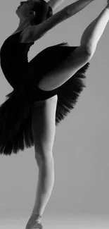 Elegant ballerina striking a pose in monochrome wallpaper.