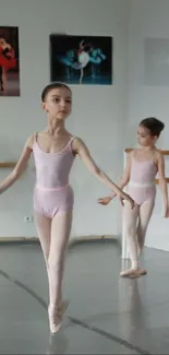 Young ballerinas practicing ballet in a studio setting.