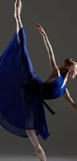 Ballet dancer performing in a blue dress.