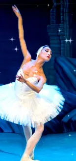 Ballet dancer in white tutu on a starry blue stage.