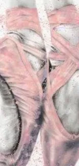 Artistic pink pointe ballet shoes on gray background.