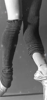 Monochrome image of a ballet dancer in pointe shoes, showcasing grace and elegance.