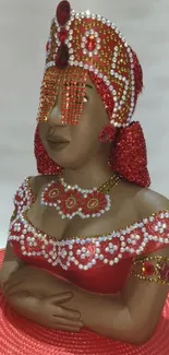 Beaded figurine in red dress with intricate detail for mobile wallpaper.