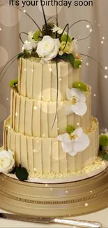 Elegant cake with white roses for birthday celebration.