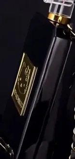 Elegant black and gold phone with chain design