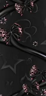 Elegant black wallpaper with pink bows.