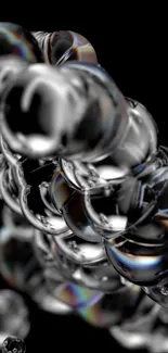 Elegant black and silver orbs design with reflective effects for mobile wallpaper.