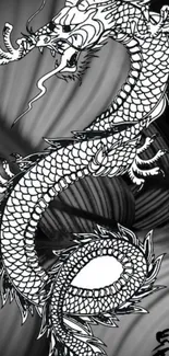 Black and white dragon with intricate scales on a gray background.