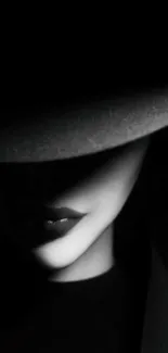 Mysterious noir wallpaper with a shadowed figure in a hat.