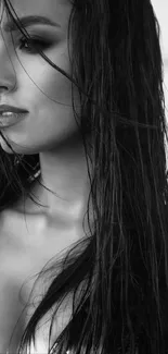 Black and white portrait of a woman with wet hair, exuding elegance and style.