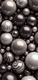 Elegant black and white spheres on mobile wallpaper.