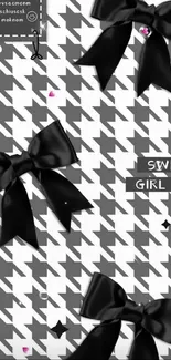 Elegant black silk bows on a houndstooth pattern wallpaper.