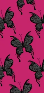 Black butterflies on vibrant pink background.