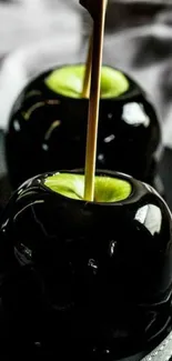 Glossy black candy apples with elegant shine.