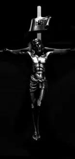 Elegant black crucifix with intricate details on a dark background.