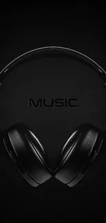 Minimalist black headphones mobile wallpaper featuring music theme.