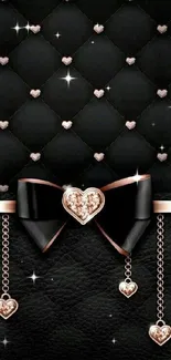 Elegant black wallpaper with heart bow and gold accents.