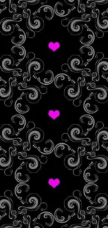 Black wallpaper with pink hearts and intricate swirls.