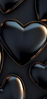 Glossy black heart shapes on a dark background.