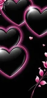 Black hearts with pink floral accents on a black background.