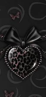 Elegant black heart wallpaper with ribbons and leopard pattern.