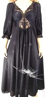 Elegant black lace dress with intricate design.