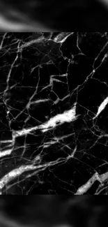 Black marble wallpaper with white veins.