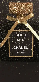 Elegant black Chanel perfume bottle with glittering gold accents.