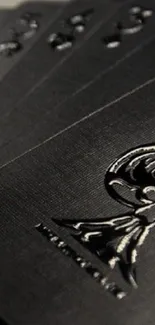 Elegantly embossed black playing cards.