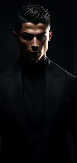 Mysterious figure in a black suit against a dark background.