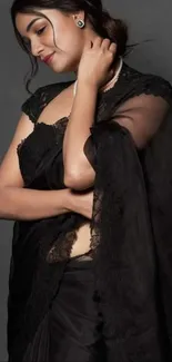 Fashionable woman in a chic black saree.