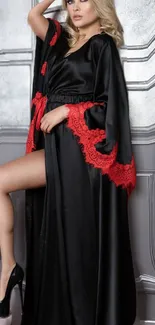 Elegant black silk robe with red lace trim for a stylish mobile wallpaper.