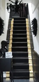 Black stairway with gold accents in a modern interior.