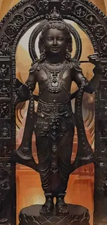 Intricate black statue with ornate design set against a warm backdrop.