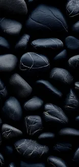 Smooth black stones mobile wallpaper.