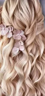 Blonde hair with pink flowers in an elegant braid.