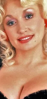 Blonde woman smiling with bright makeup.