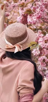 Woman in hat with cherry blossoms mobile wallpaper.