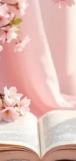 Cherry blossoms with an open book, exuding tranquility.